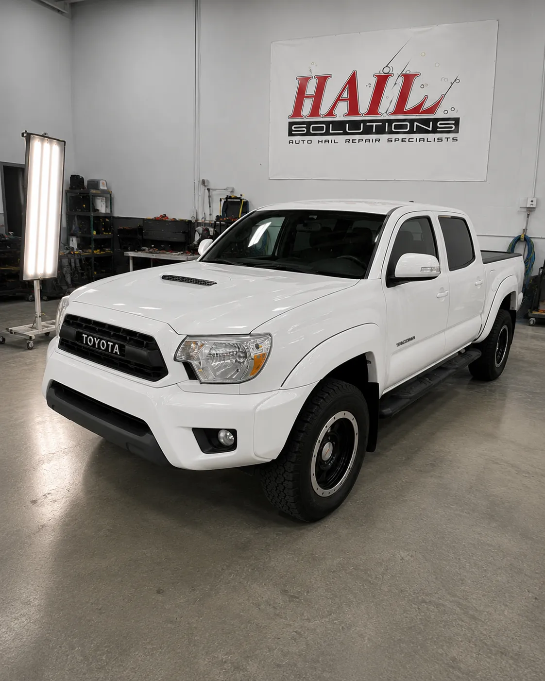 Detail photo of 2015 Toyota Tacoma — Super White hail damage repair in Raytown, MO