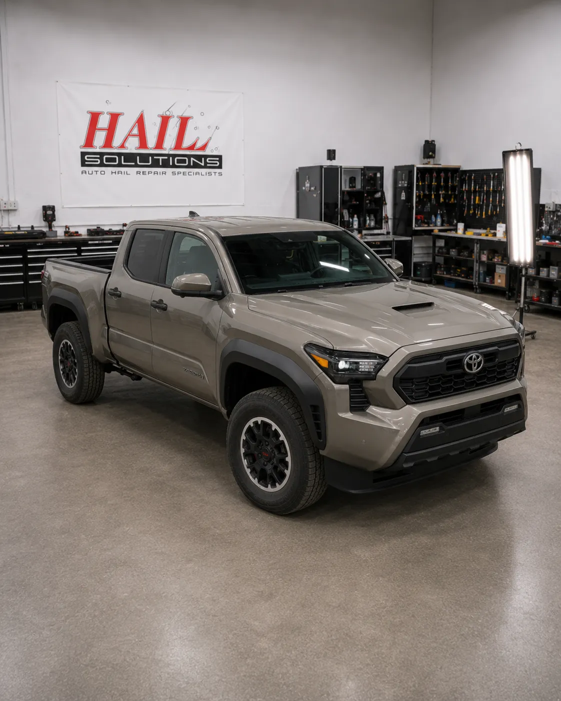 Detail photo of 2024 Toyota Tacoma — Cement Gray hail damage repair in Olathe, KS