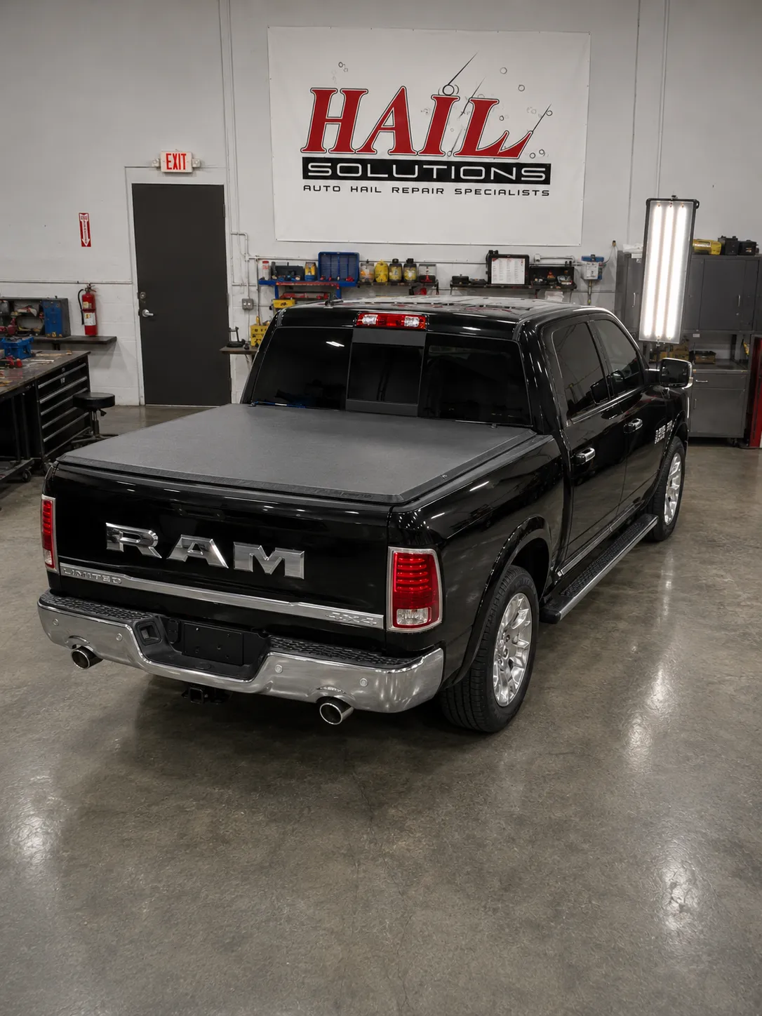 Detail photo of 2015 Ram 1500 — Brilliant Black Crystal Pearl hail damage repair in Smithville, MO