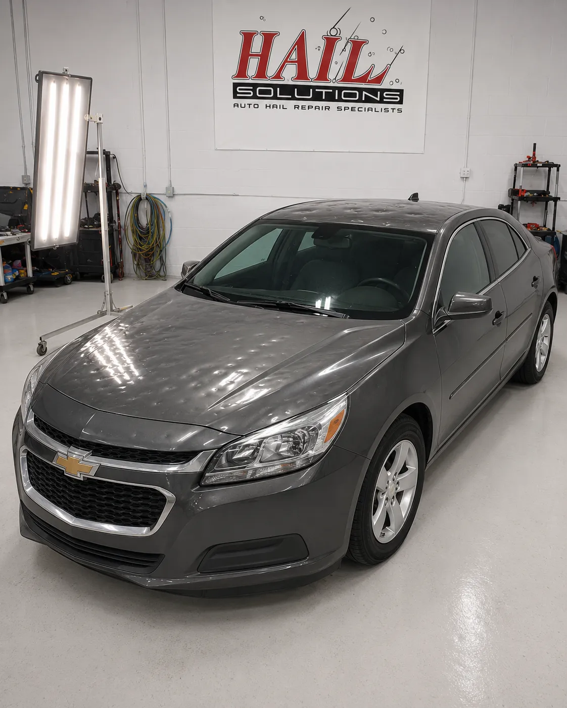 Detail photo of 2015 Chevrolet Malibu — Ashen Gray Metallic hail damage repair in Topeka, KS