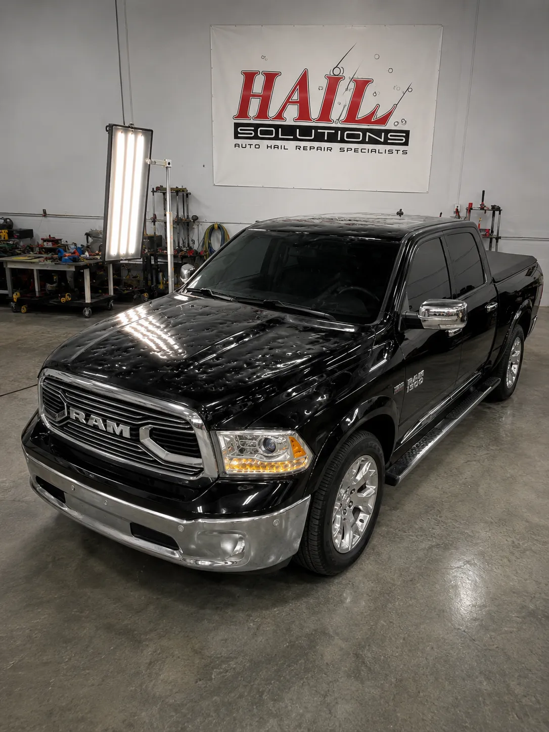 Detail photo of 2015 Ram 1500 — Brilliant Black Crystal Pearl hail damage repair in Smithville, MO