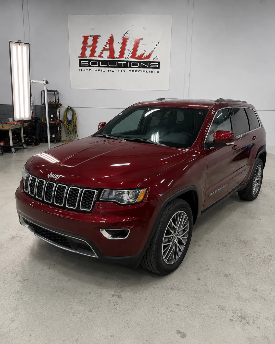 Detail photo of 2017 Jeep Grand Cherokee — Velvet Red Pearl hail damage repair in Prairie Village, KS