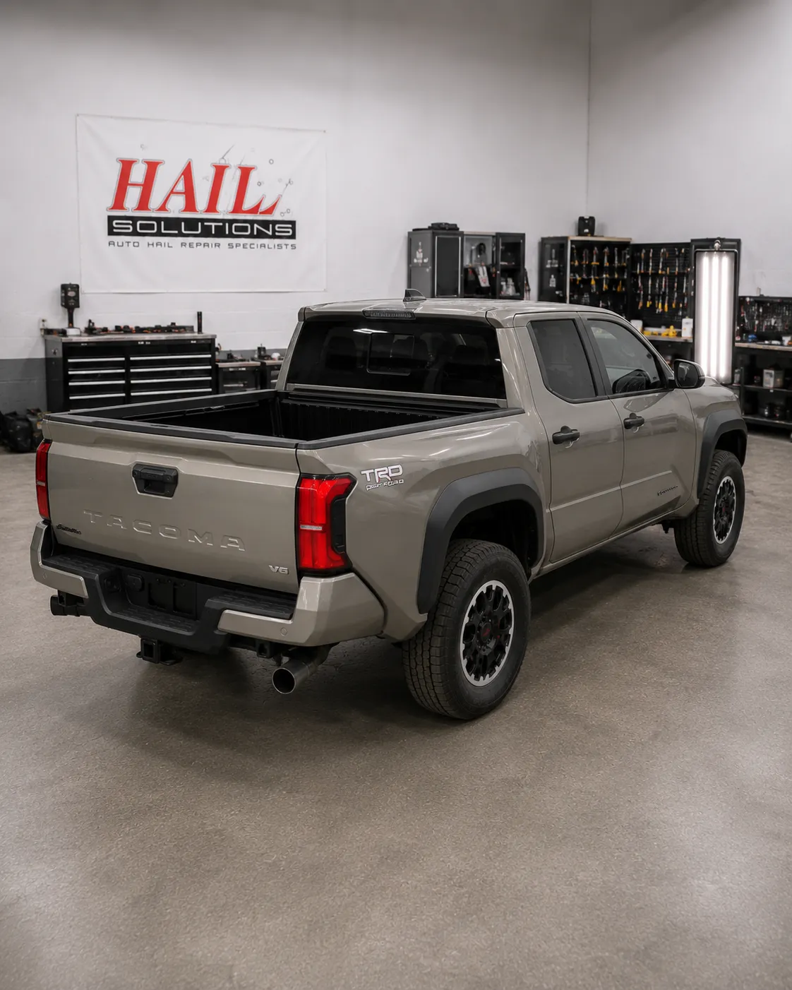 Detail photo of 2024 Toyota Tacoma — Cement Gray hail damage repair in Olathe, KS
